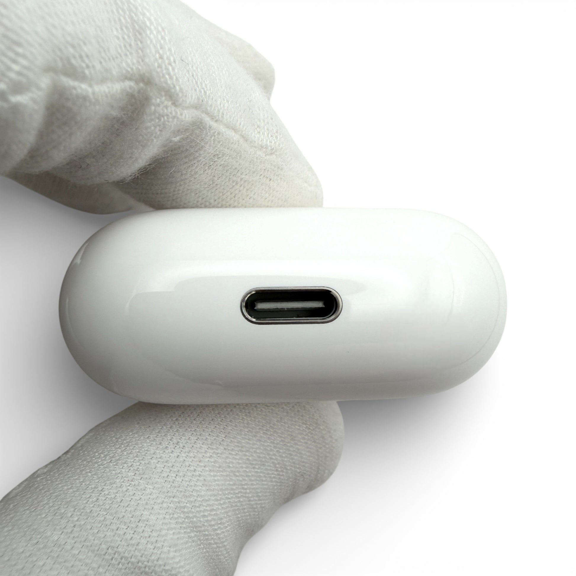 Apple AirPods 4 charging case without ANC, underside showing the plain USB-C port
