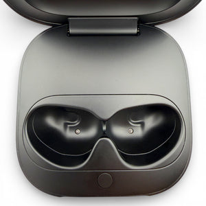 Beats Fit Pro charging case in black, open showing the earbud charging cradles