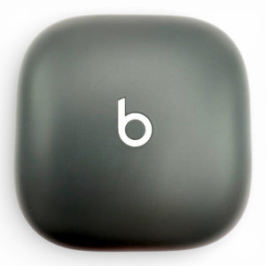 Beats Fit Pro charging case in gray, front view showing the Beats logo