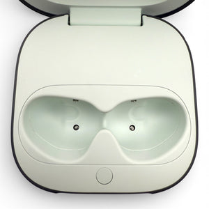 Beats Fit Pro charging case in gray, open showing the earbud charging cradles