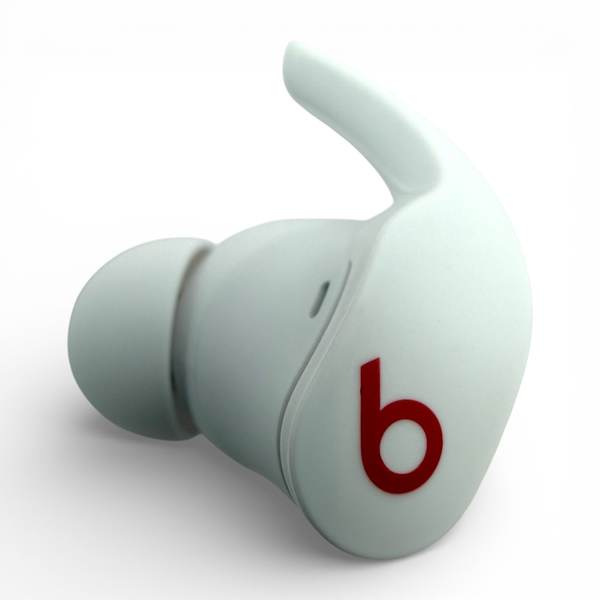 Left replacement Beats Fit Pro earbud in white, front view showing the Beats logo and ear tip