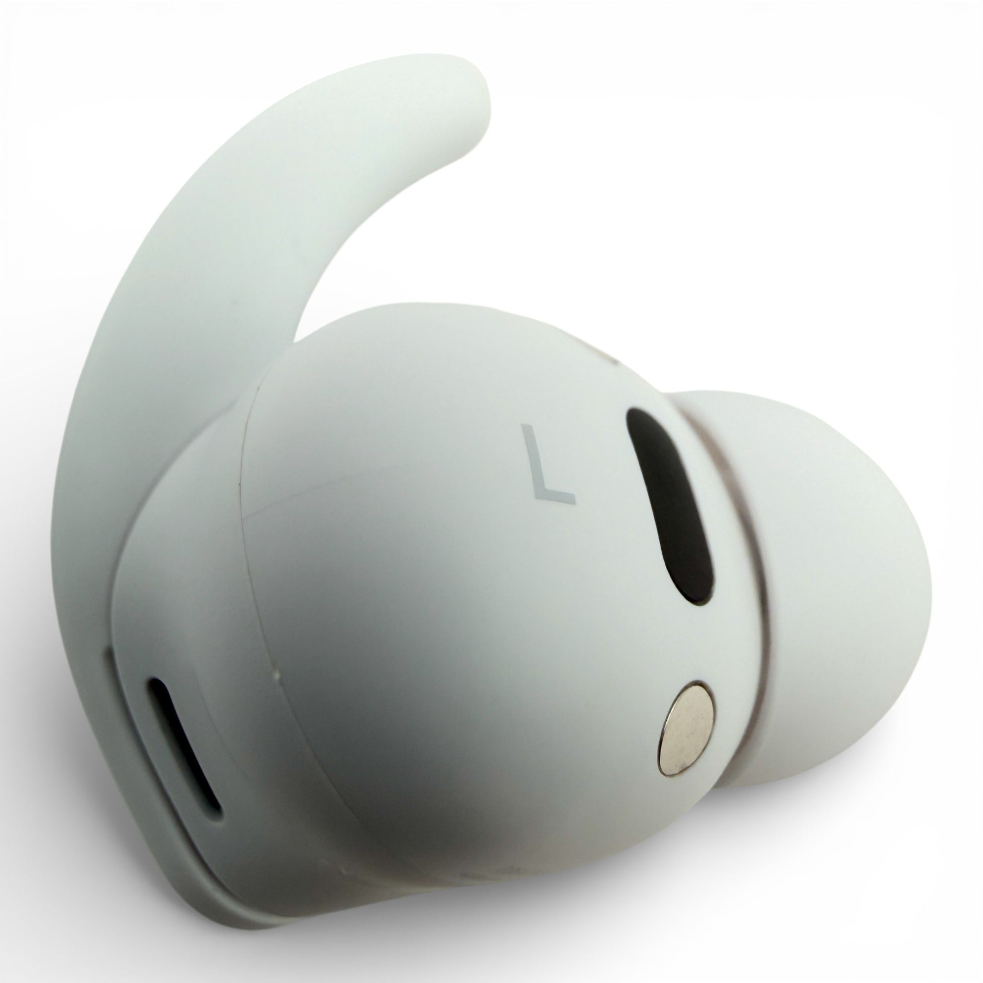Left replacement Beats Fit Pro earbud in white, side view showing the L marking and charging contact
