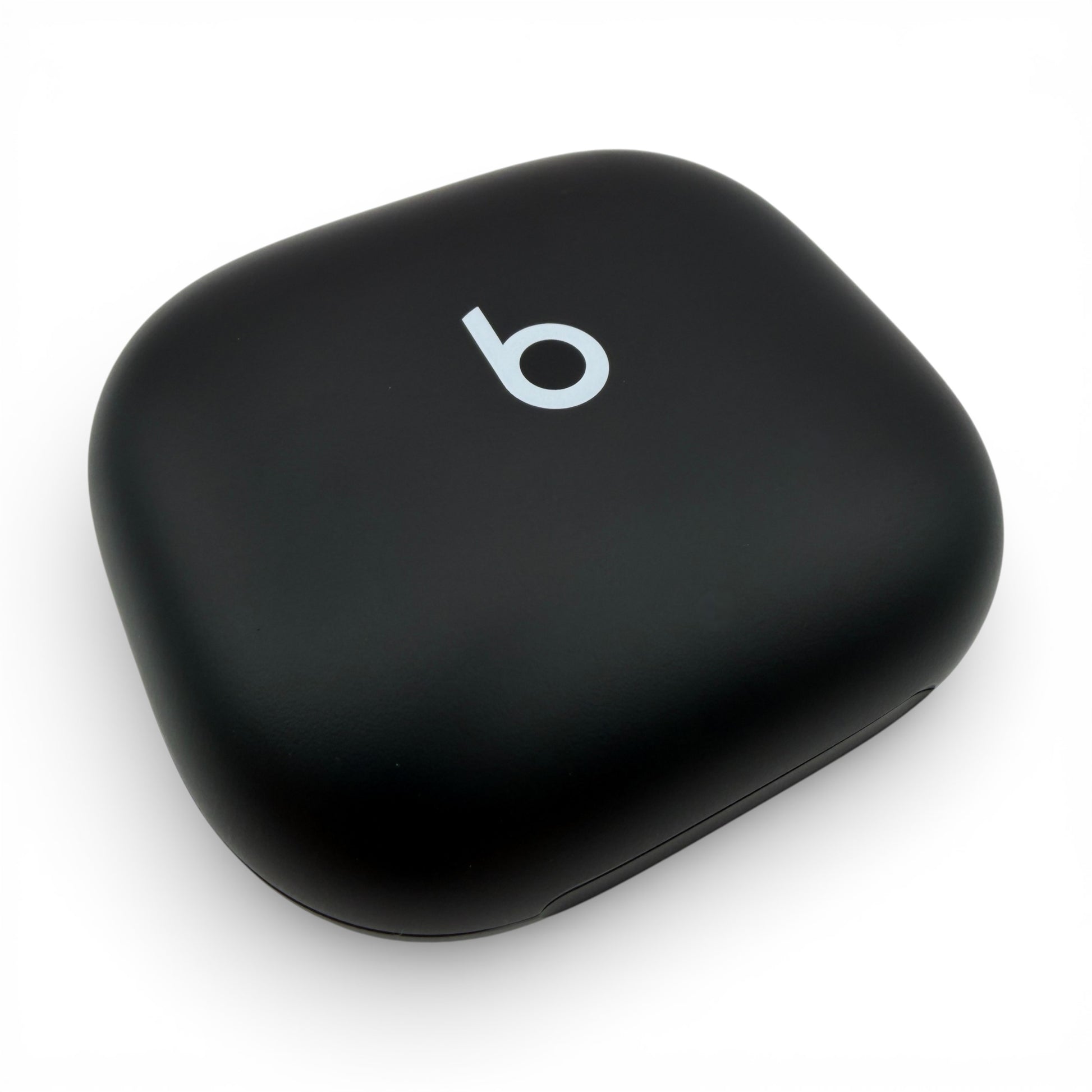Beats Powerbeats Fit charging case in black, angled view of the closed lid