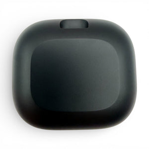 Beats Powerbeats Fit charging case in black, underside view showing the hinge notch