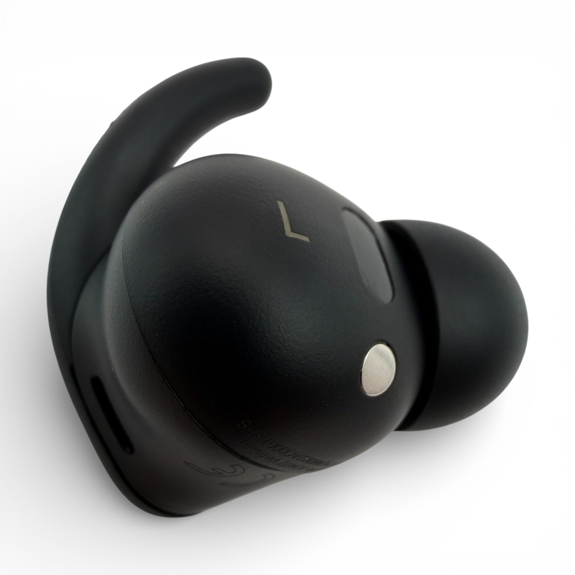 Left Powerbeats Fit earbud in black, back view showing the L marking and pairing button