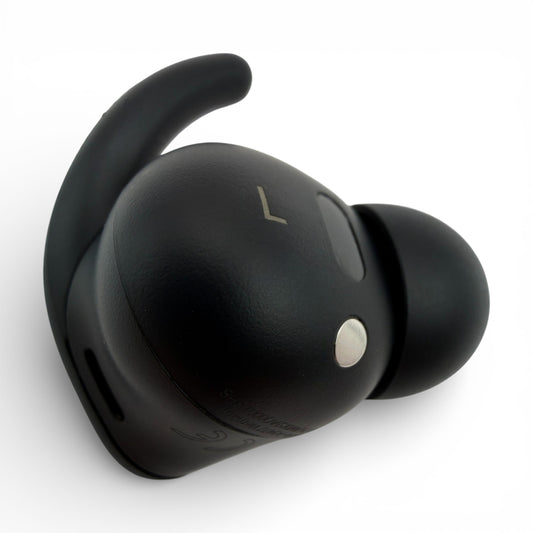 Left Powerbeats Fit earbud in black, back view showing the L marking and pairing button