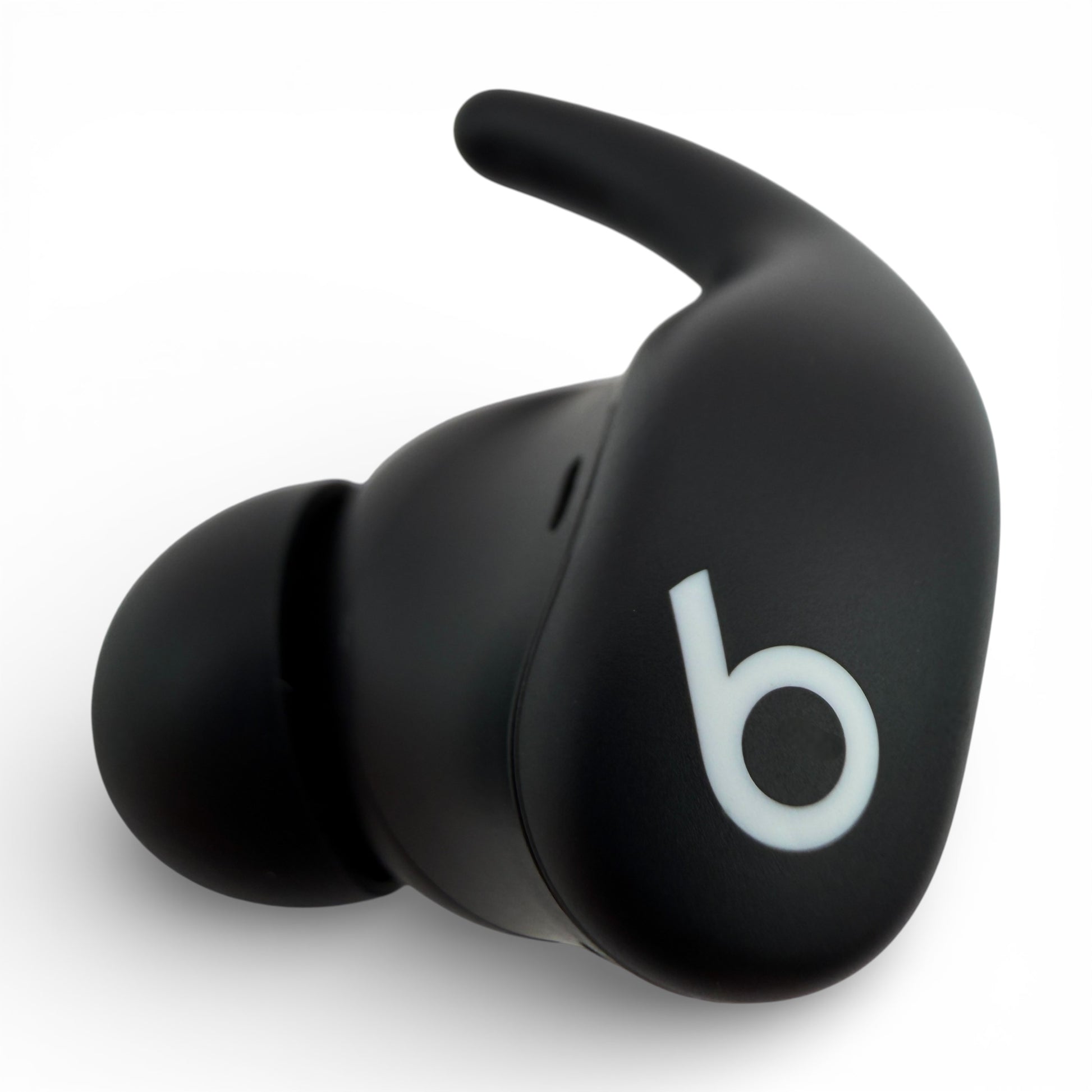 Left Powerbeats Fit earbud in black, front view showing the logo and ear hook