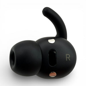 Right replacement Powerbeats Fit earbud in black, side view with ear tip attached showing the R marking