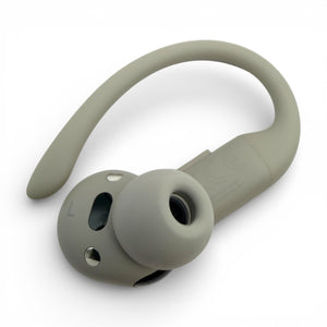 Left replacement Powerbeats Pro 2 earbud in gray, back view showing the L label and charging contacts