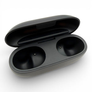 Beats Solo Buds charging case in black, open showing the two empty earbud charging bays