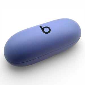 Beats Solo Buds charging case in purple, closed lid at an angle showing the logo