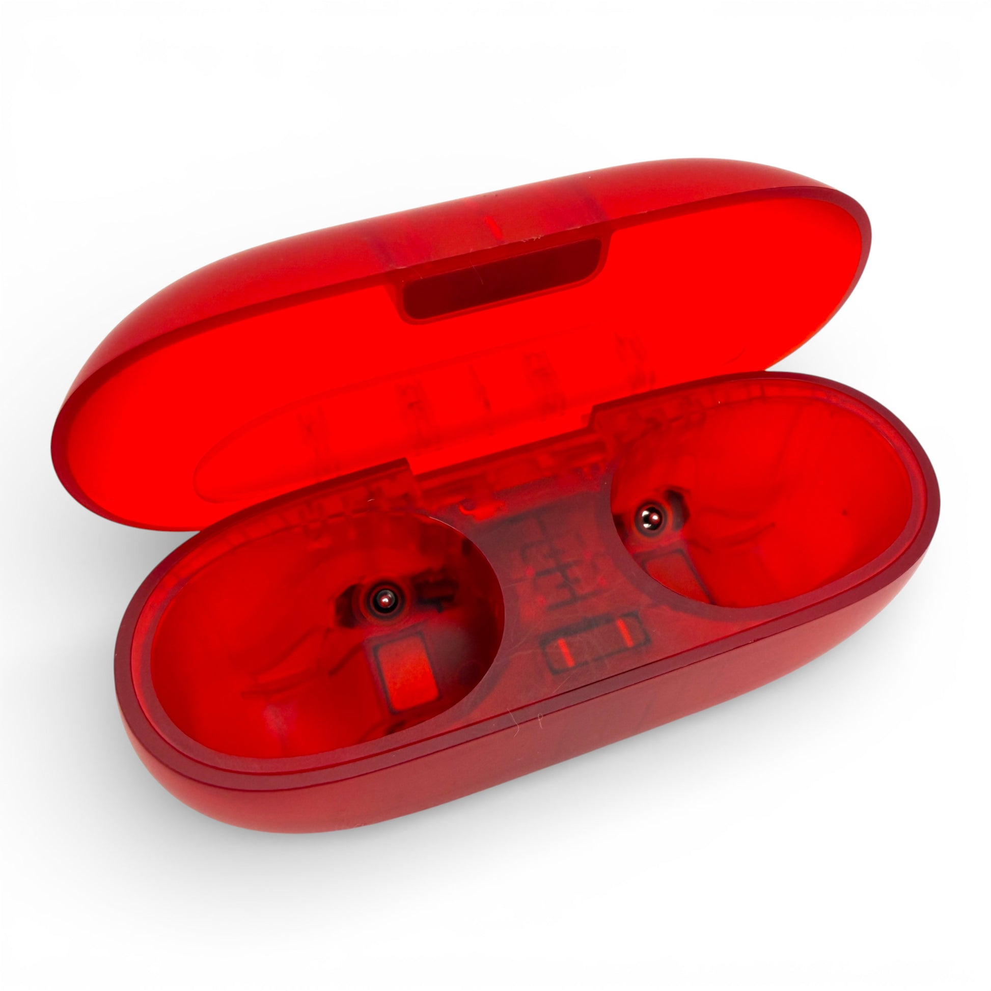 Beats Solo Buds charging case in red, open showing the two empty earbud charging bays