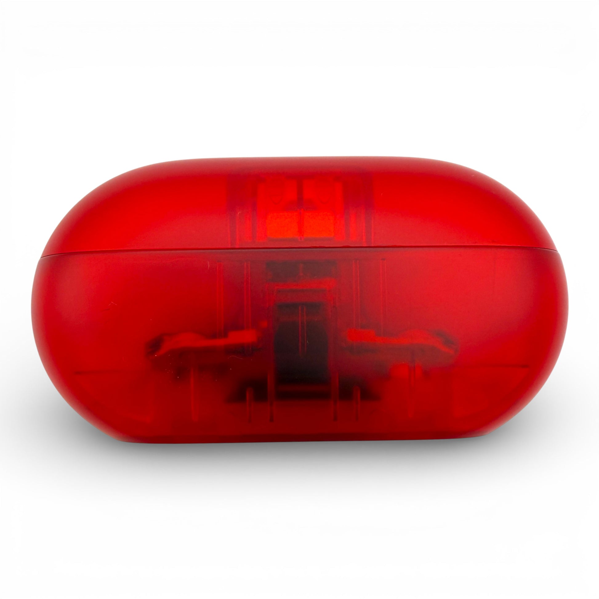 Beats Solo Buds charging case in red, side view of the closed translucent case