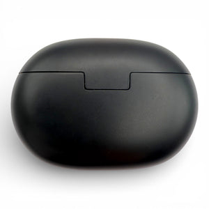 Beats Studio Buds charging case in black, back view showing the hinge seam