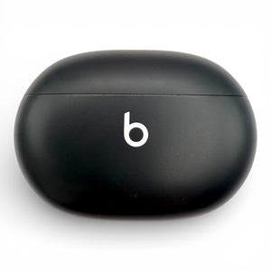 Beats Studio Buds replacement charging case in black, closed front view with logo