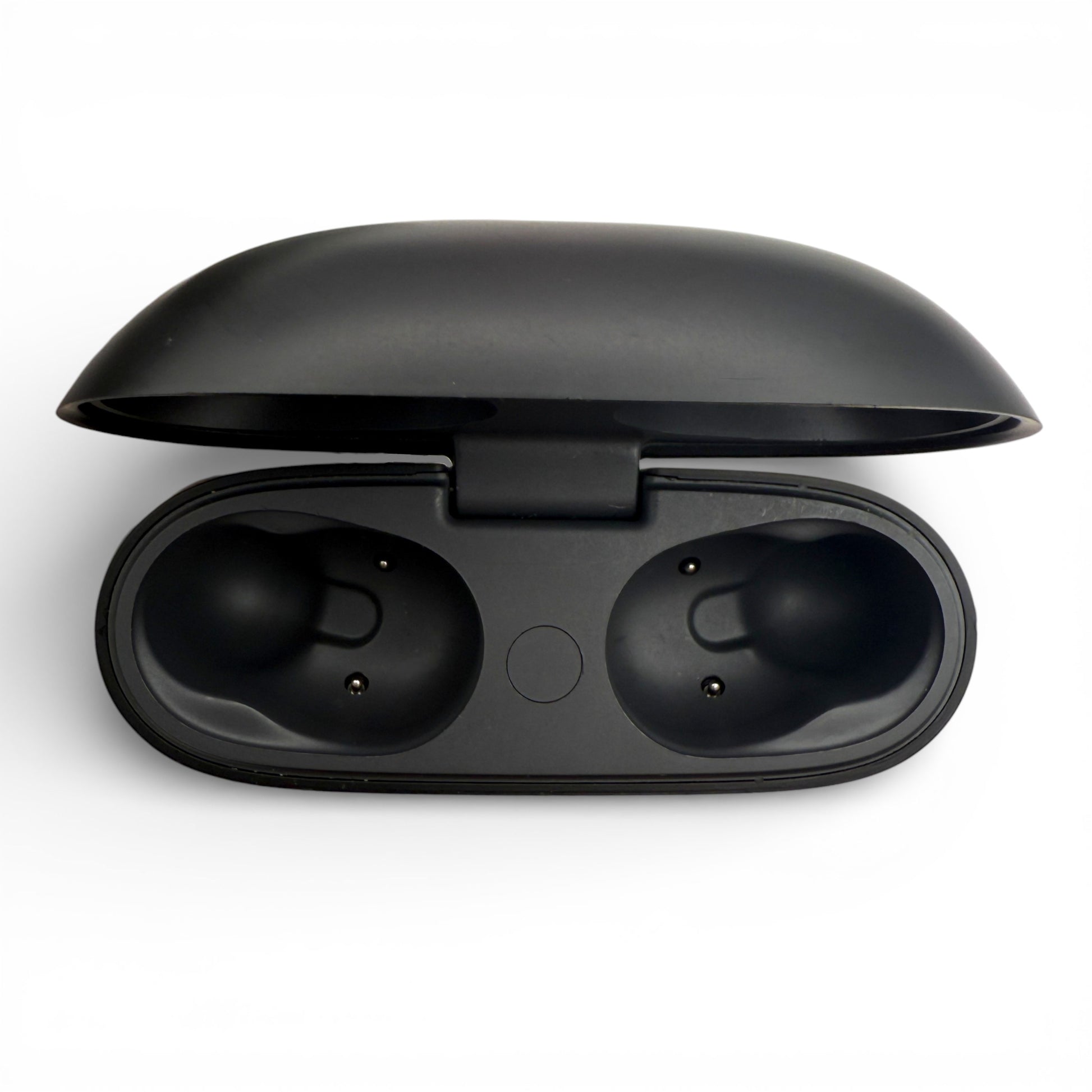 Beats Studio Buds charging case in black, opened showing the empty earbud slots