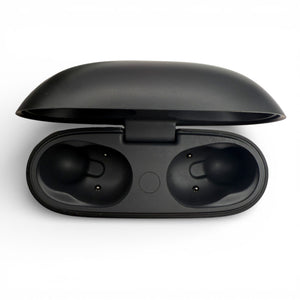 Beats Studio Buds charging case in black, opened showing the empty earbud slots