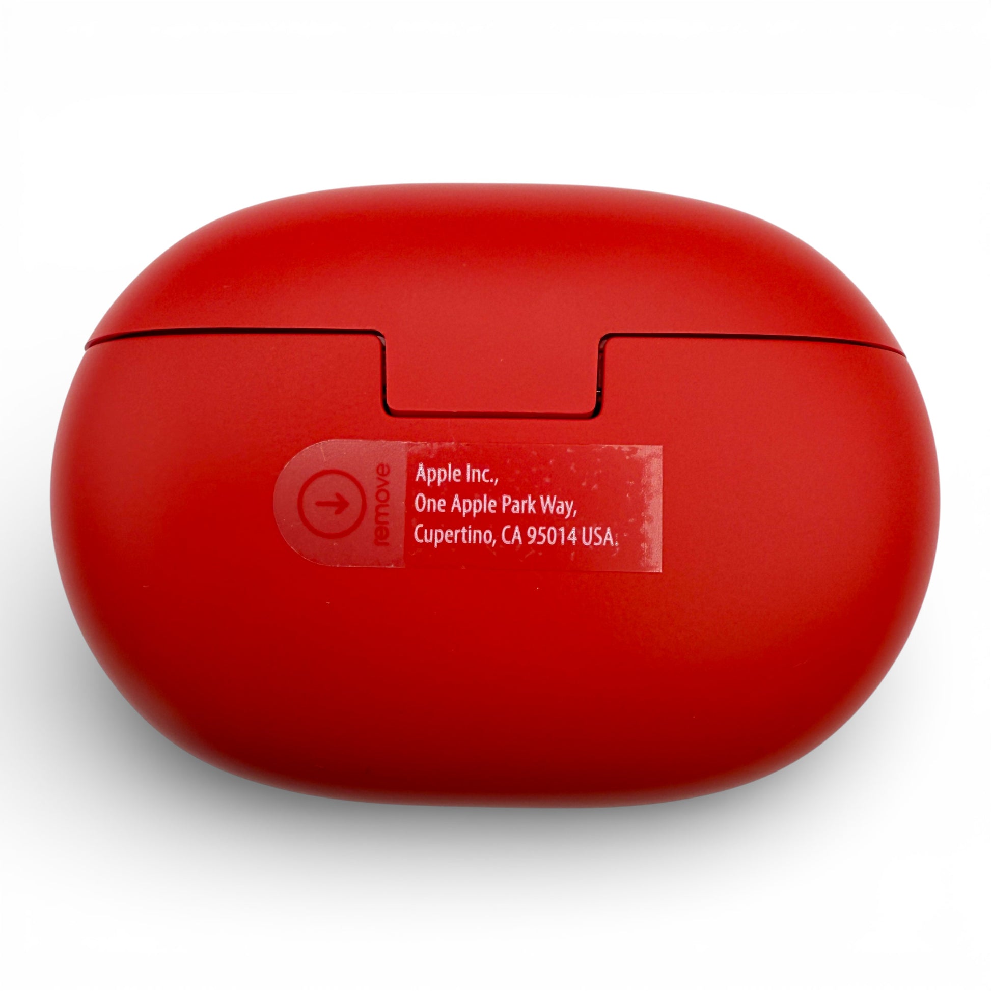 Beats Studio Buds charging case in red, back view showing the manufacturer label