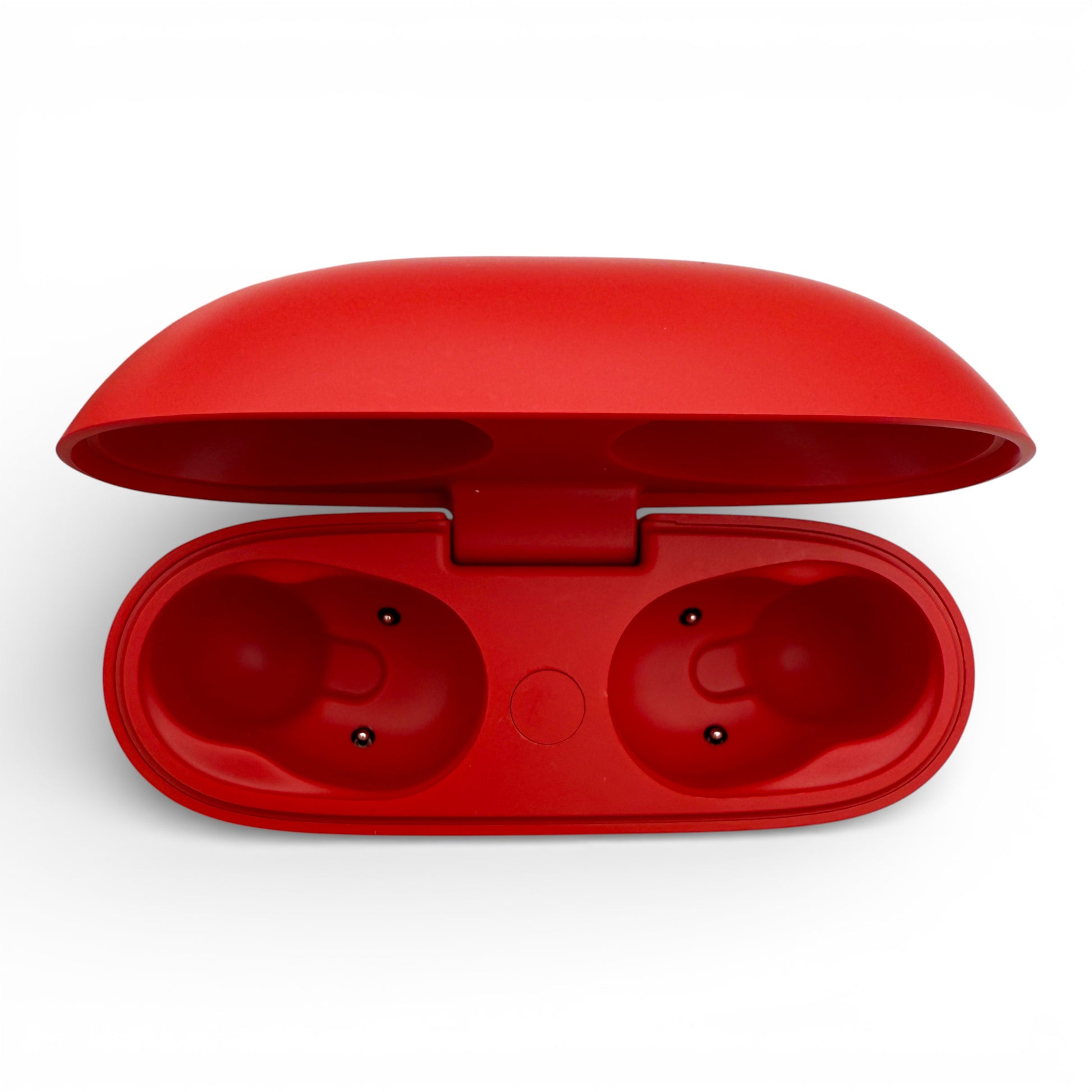 Beats Studio Buds charging case in red, opened showing the empty earbud slots