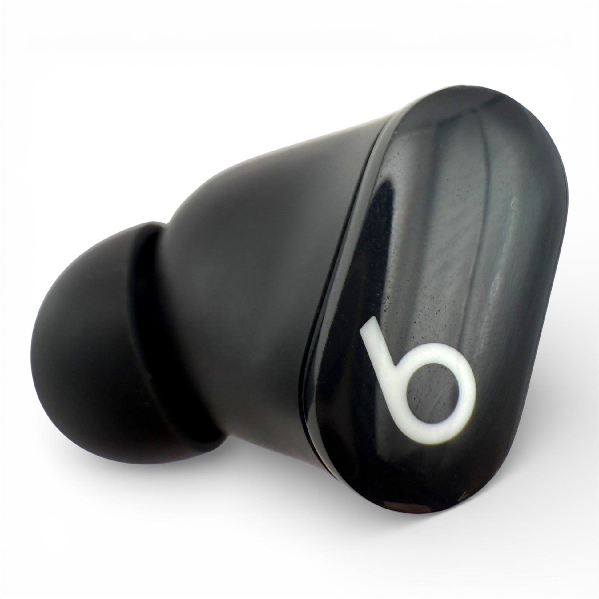 Left replacement Beats Studio Buds earbud in black, glossy front view showing the logo and ear tip