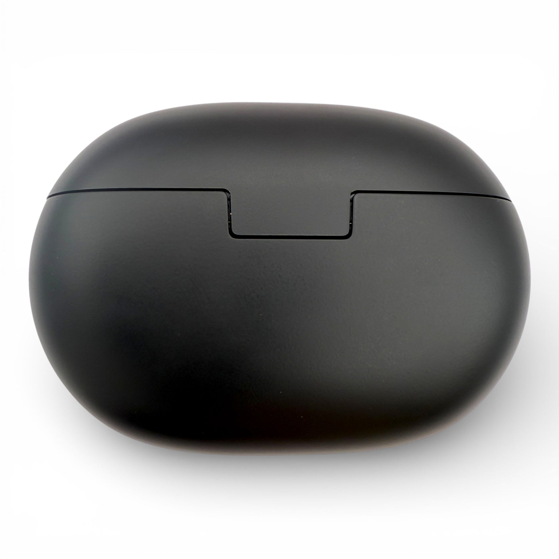 Beats Studio Buds+ charging case in black, closed back view showing the opening notch