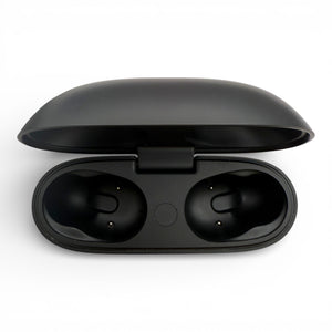 Beats Studio Buds+ charging case in black, open lid revealing two empty earbud slots