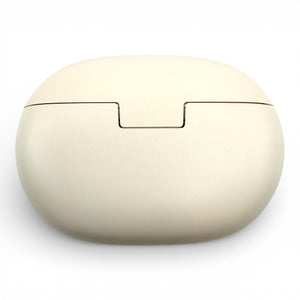 Beats Studio Buds+ charging case in ivory, closed back view showing the opening notch