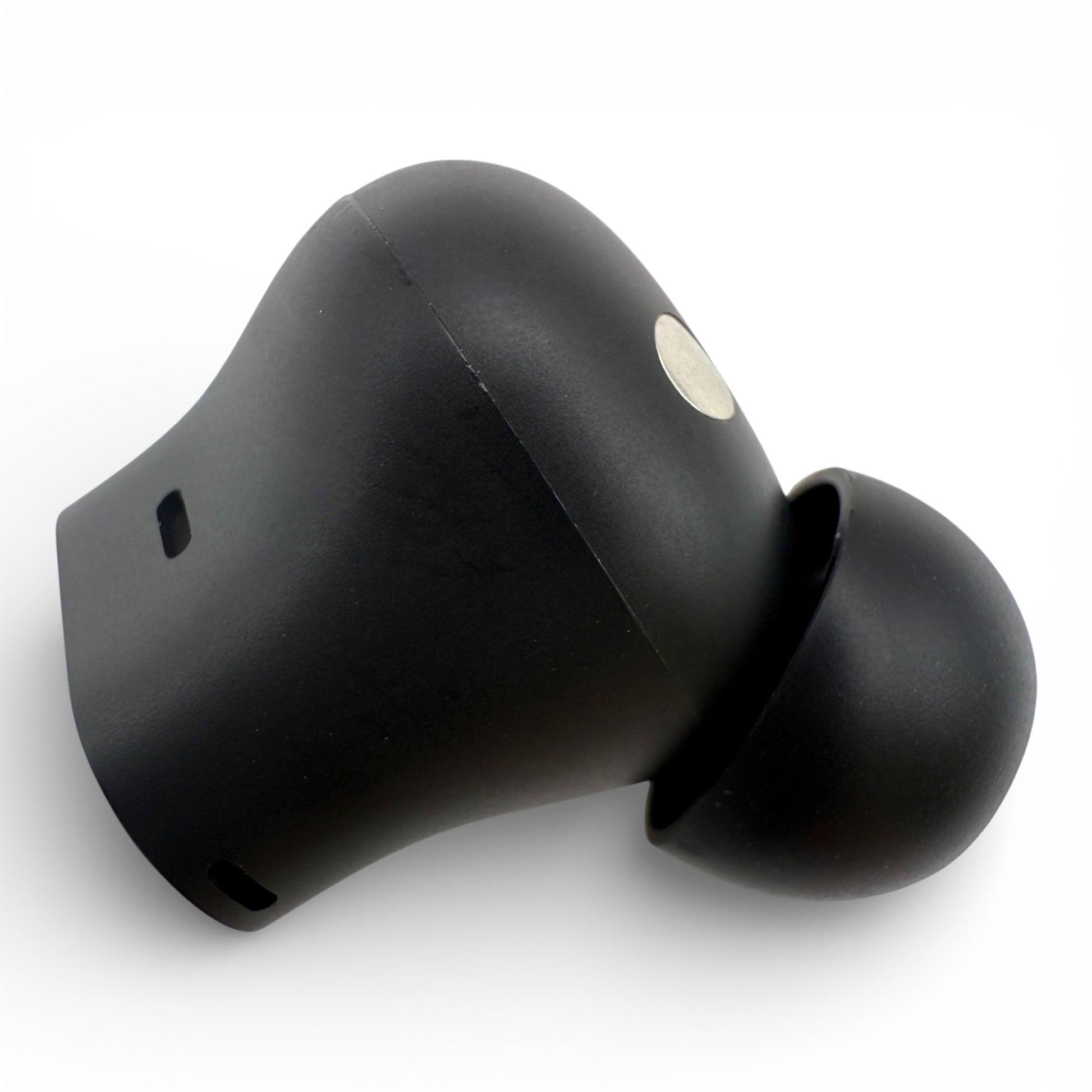 Left Beats Studio Buds+ earbud in black, side view showing the charging contact