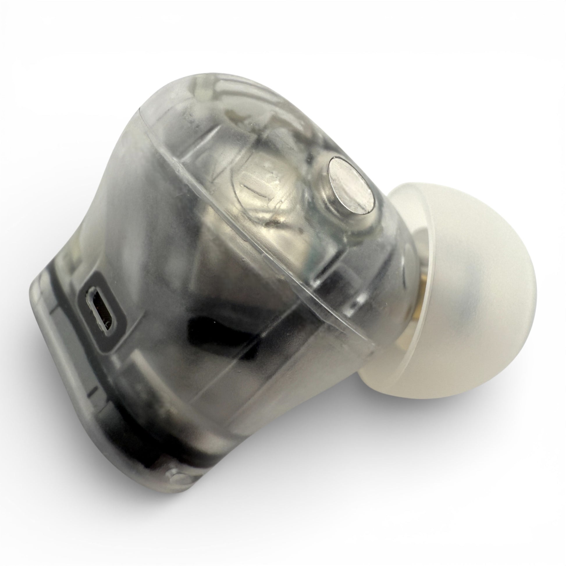 Right replacement Beats Studio Buds Plus earbud in clear, side view showing the charging port and ear tip