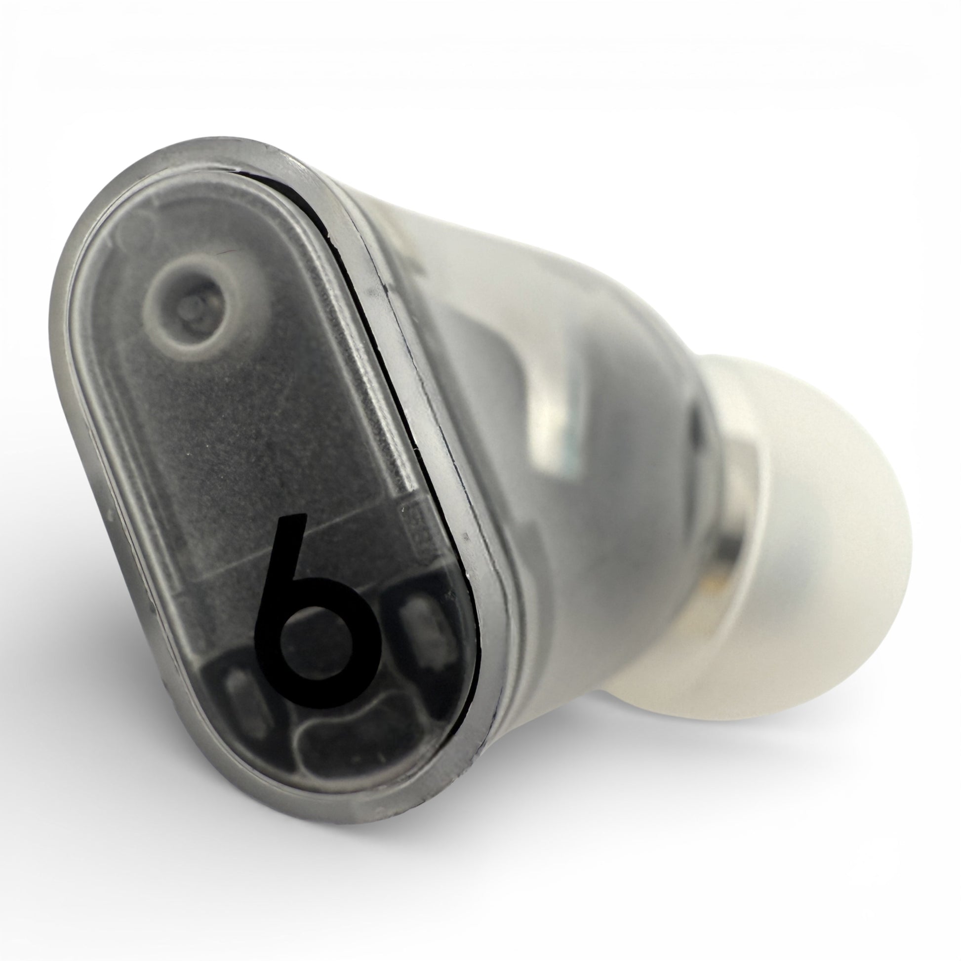 Right replacement Beats Studio Buds Plus earbud in clear, top view showing the translucent shell and ear tip