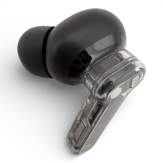 Left Nothing ear (2) earbud in black, front view showing the ear tip and transparent stem with charging contacts