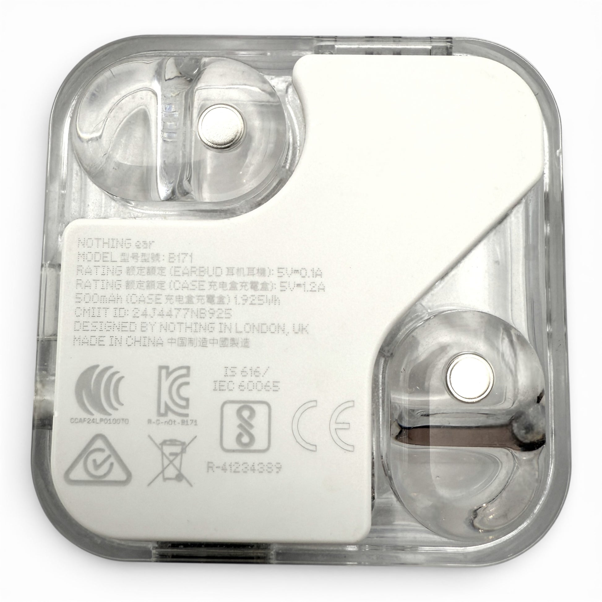 Nothing ear charging case in white, underside view showing the earbuds and product information label