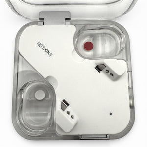 Nothing ear charging case in white, open view showing both earbuds seated inside with charging pins visible