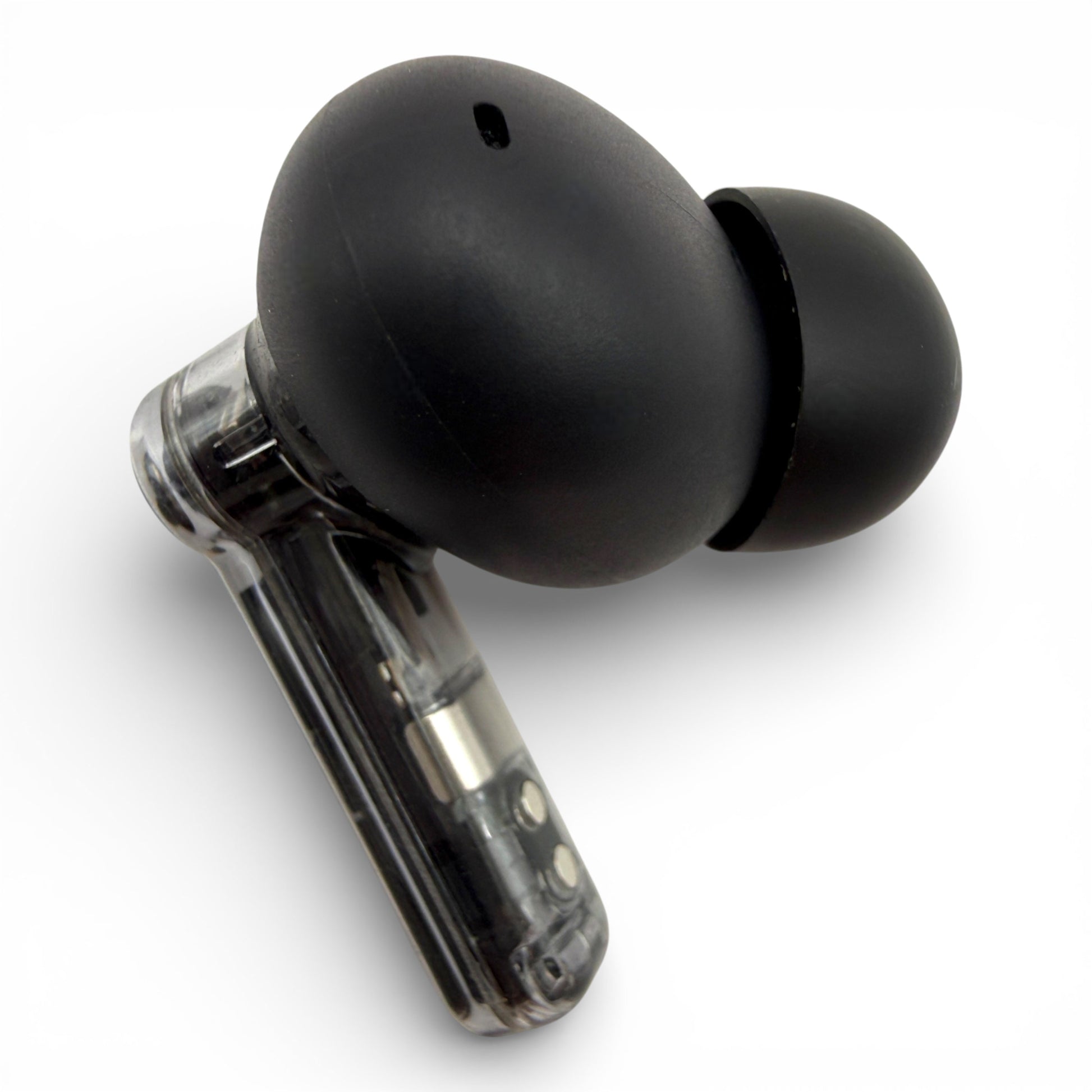 Left Nothing ear earbud in black, back view showing the rounded shell and edge of the transparent stem
