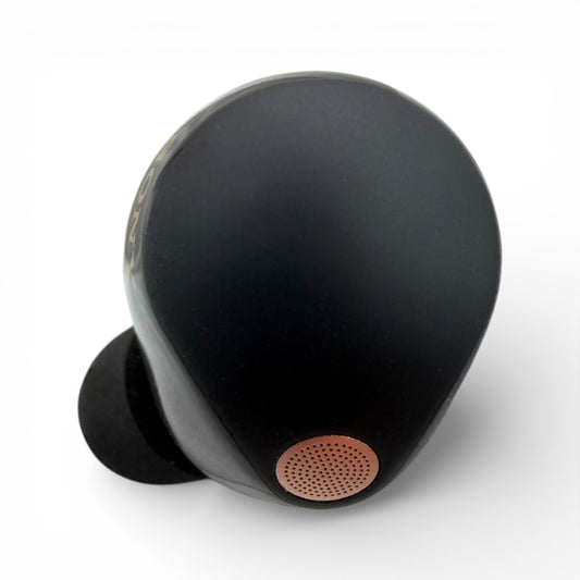 Left replacement Sony WF-1000XM5 earbud in black, top view showing the speaker mesh and ear tip attached