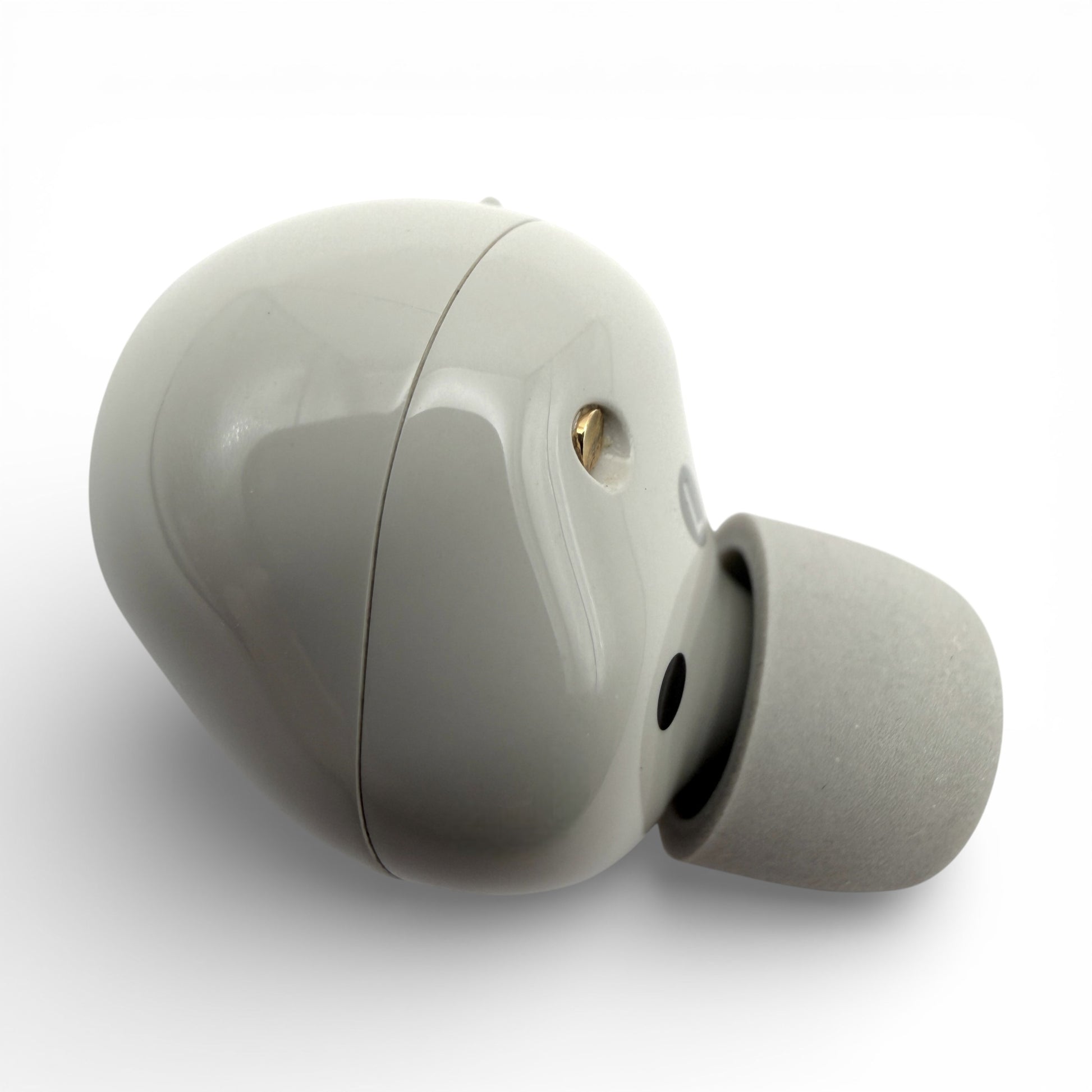 Left replacement Sony WF-1000XM5 earbud in white, back view showing the glossy housing and sensor dot