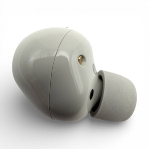 Left replacement Sony WF-1000XM5 earbud in white, back view showing the glossy housing and sensor dot